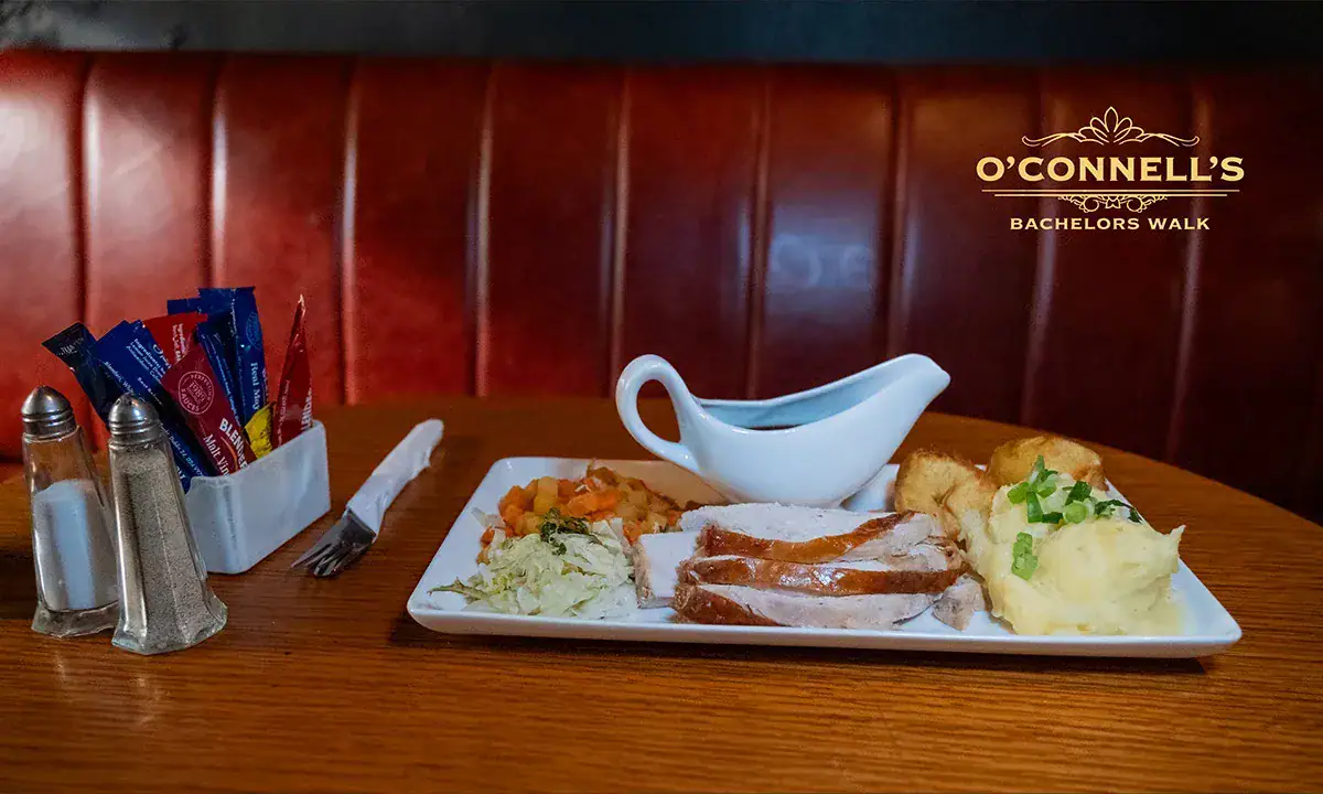 Traditional Irish meal served at O'Connell's Bar Dublin with steak, mashed potatoes, and vegetables.